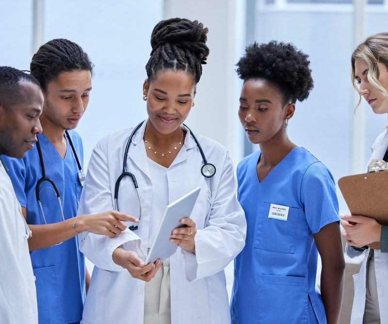 Diversity,,Healthcare,And,Staff,With,Tablet,,Talking,And,Planning,For